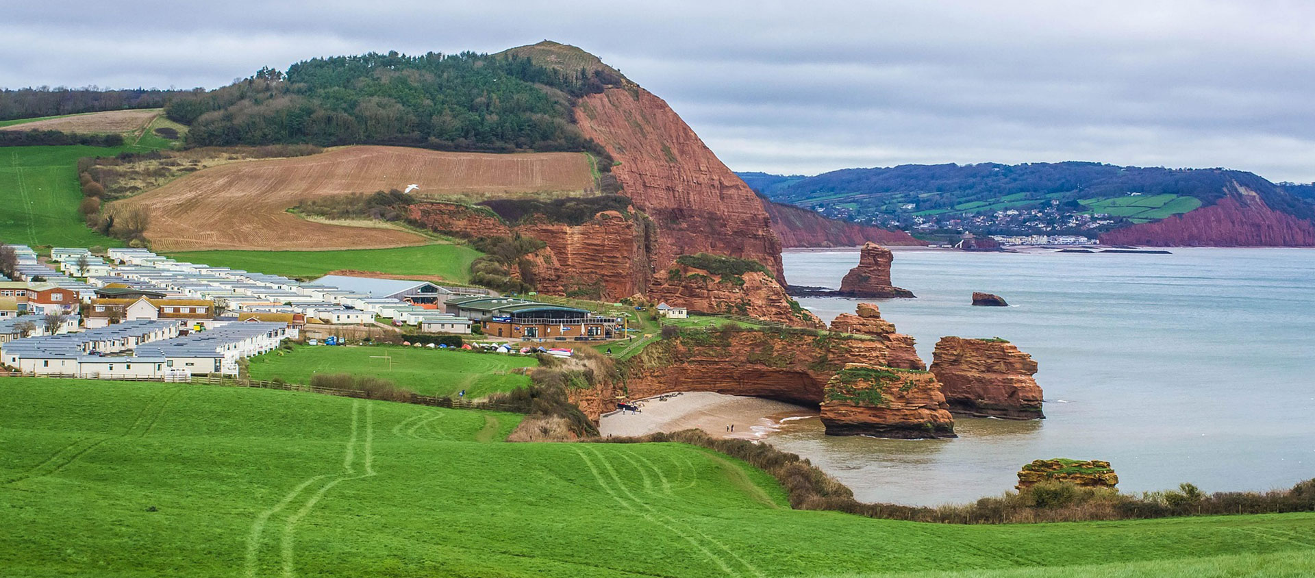 Langstone Rock and red sandstone cliffs at Dawlish Warren in Devon