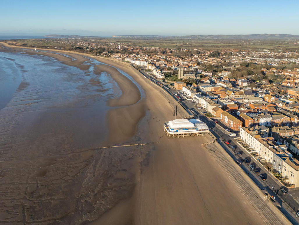 Aerial view of Burnham-on-Sea beach, seafront and town centre in Somerset