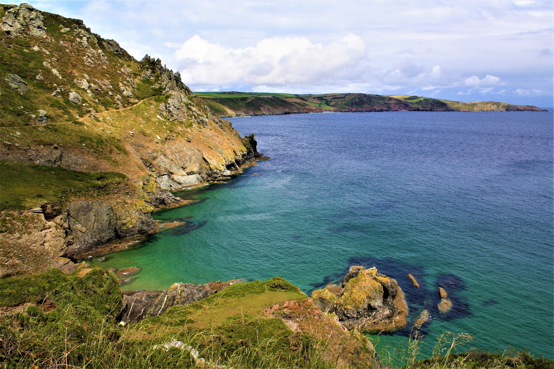 Rugged coastline and clear blue sea near Ilfracombe in North Devon