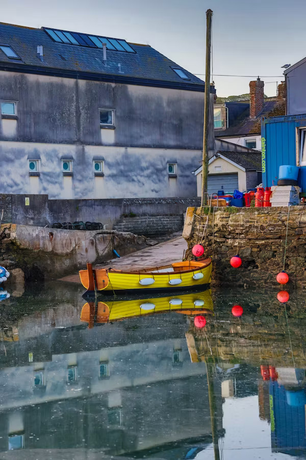 Colourful boat moored in Salcombe Harbour in South Devon