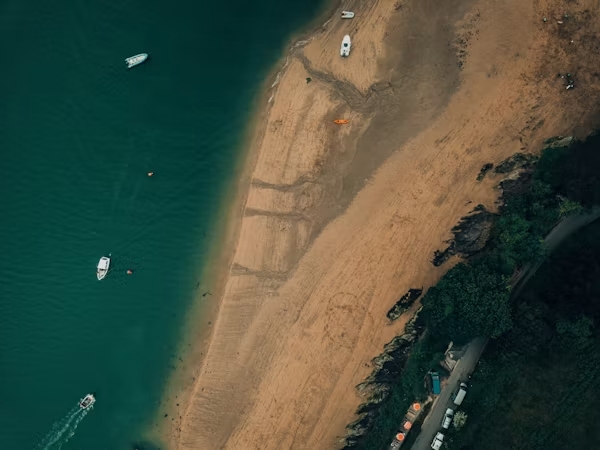 Aerial view of the shoreline and boats on the Salcombe estuary in South Devon