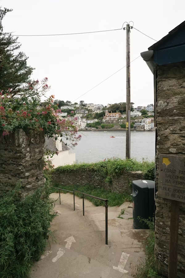 Coast path overlooking Salcombe estuary and hillside homes in South Devon