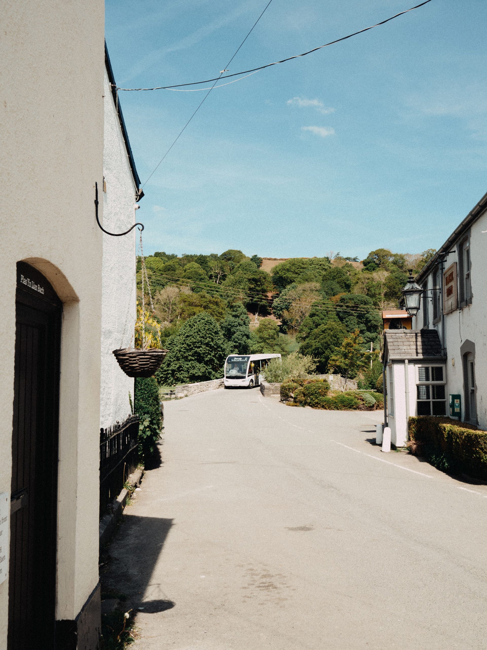 Traditional buildings and stone bridge on a quiet street in Camelford Cornwall