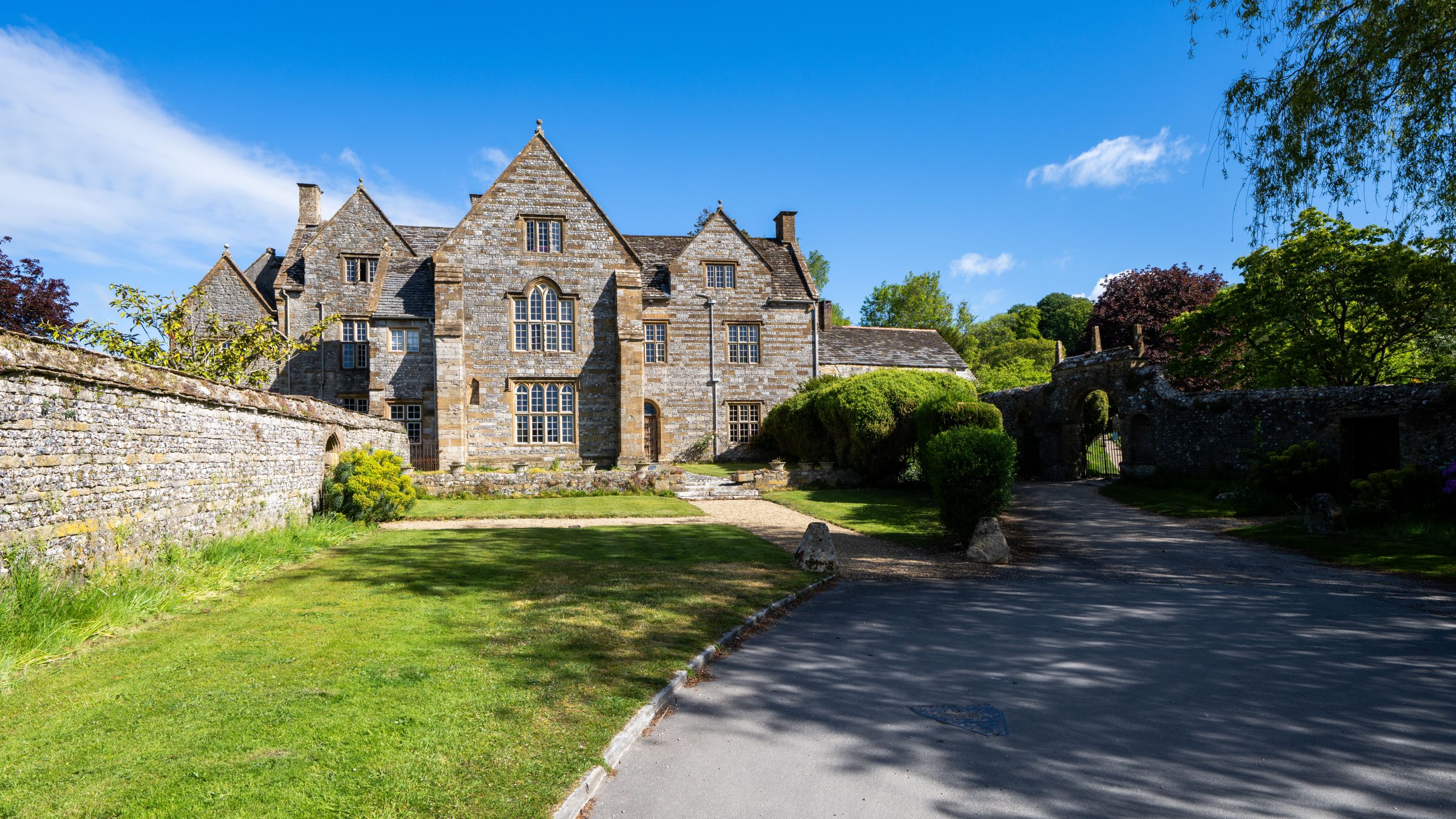 Historic stone building and gardens in Cerne Abbas, Dorset