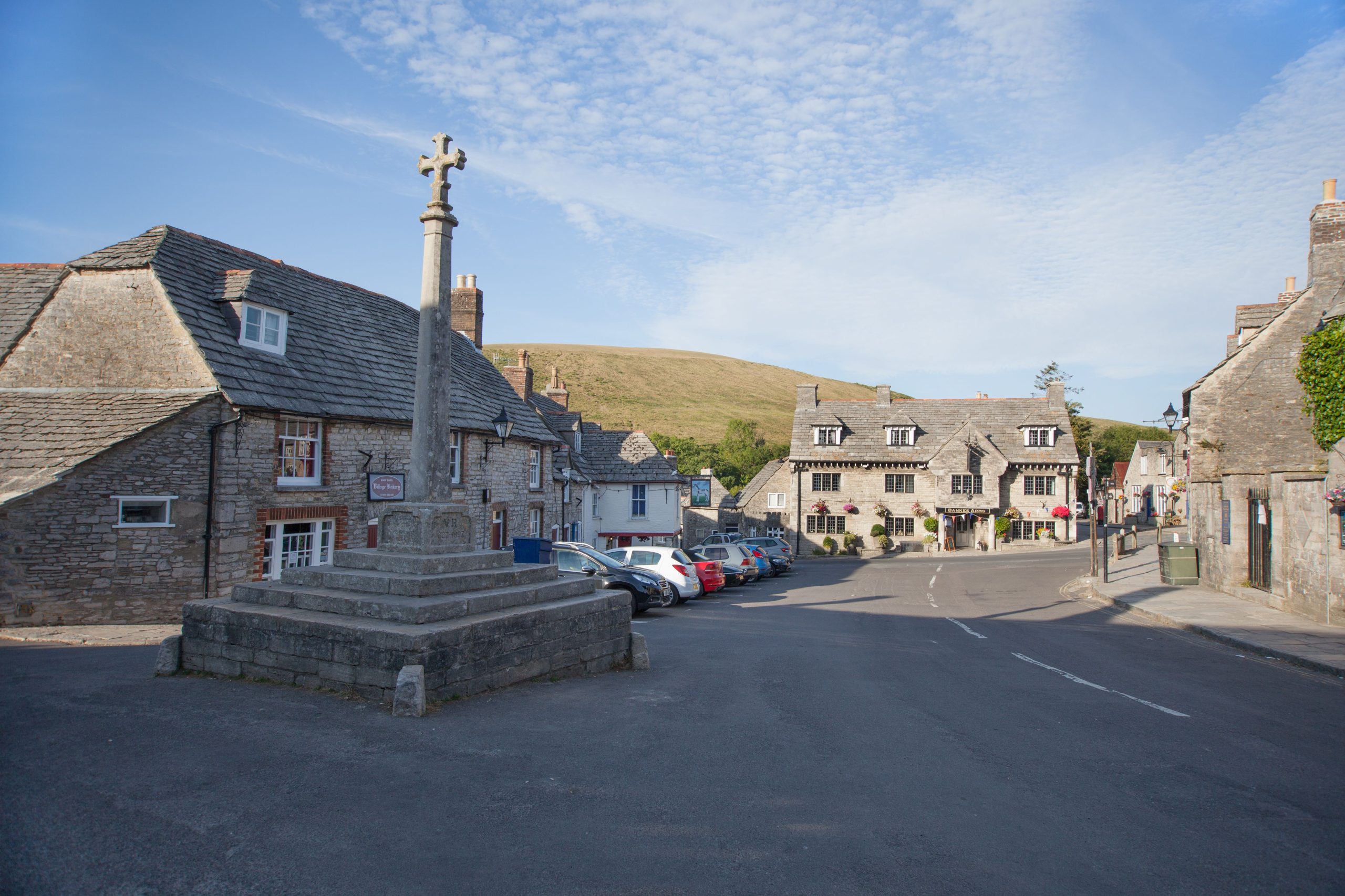 Corfe Castle village centre with traditional stone buildings in Dorset