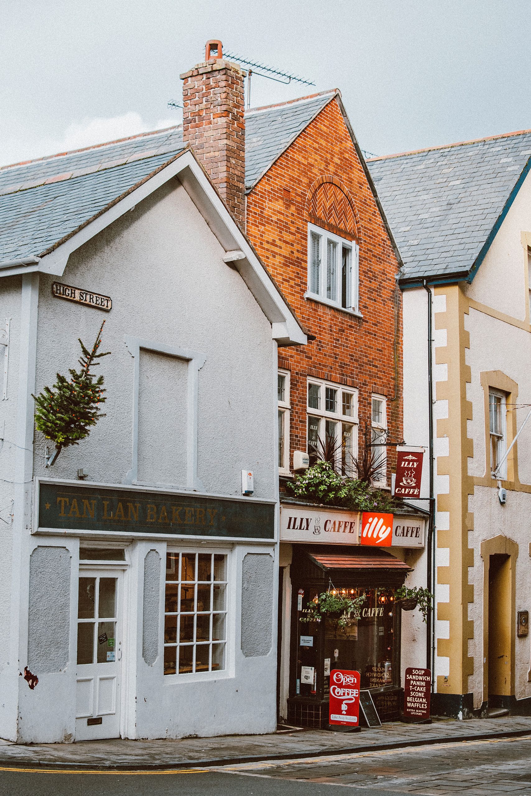 Traditional shops, bakery and café on High Street in Liskeard Cornwall