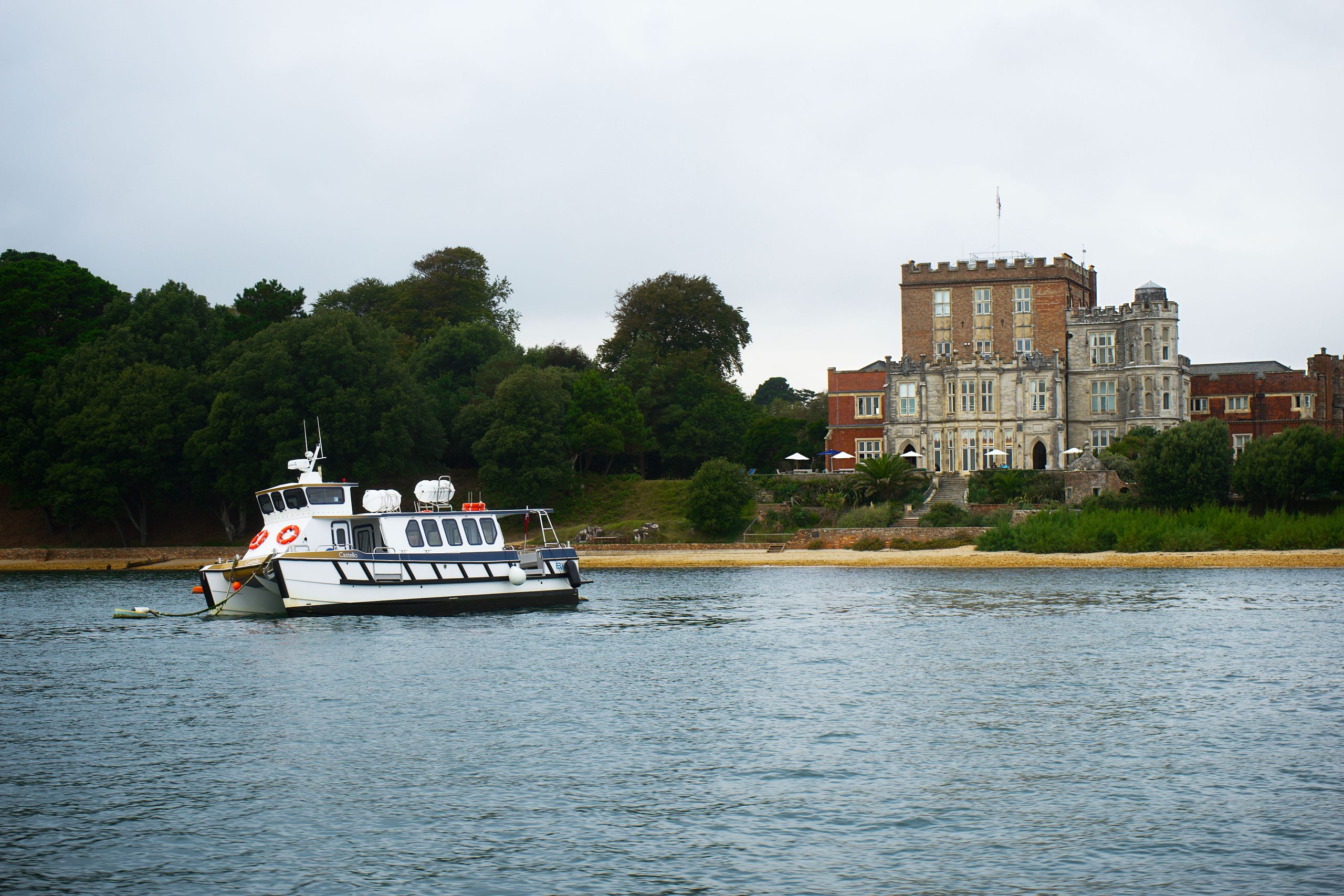 Boat on Poole Harbour with Brownsea Island in the background, Dorset
