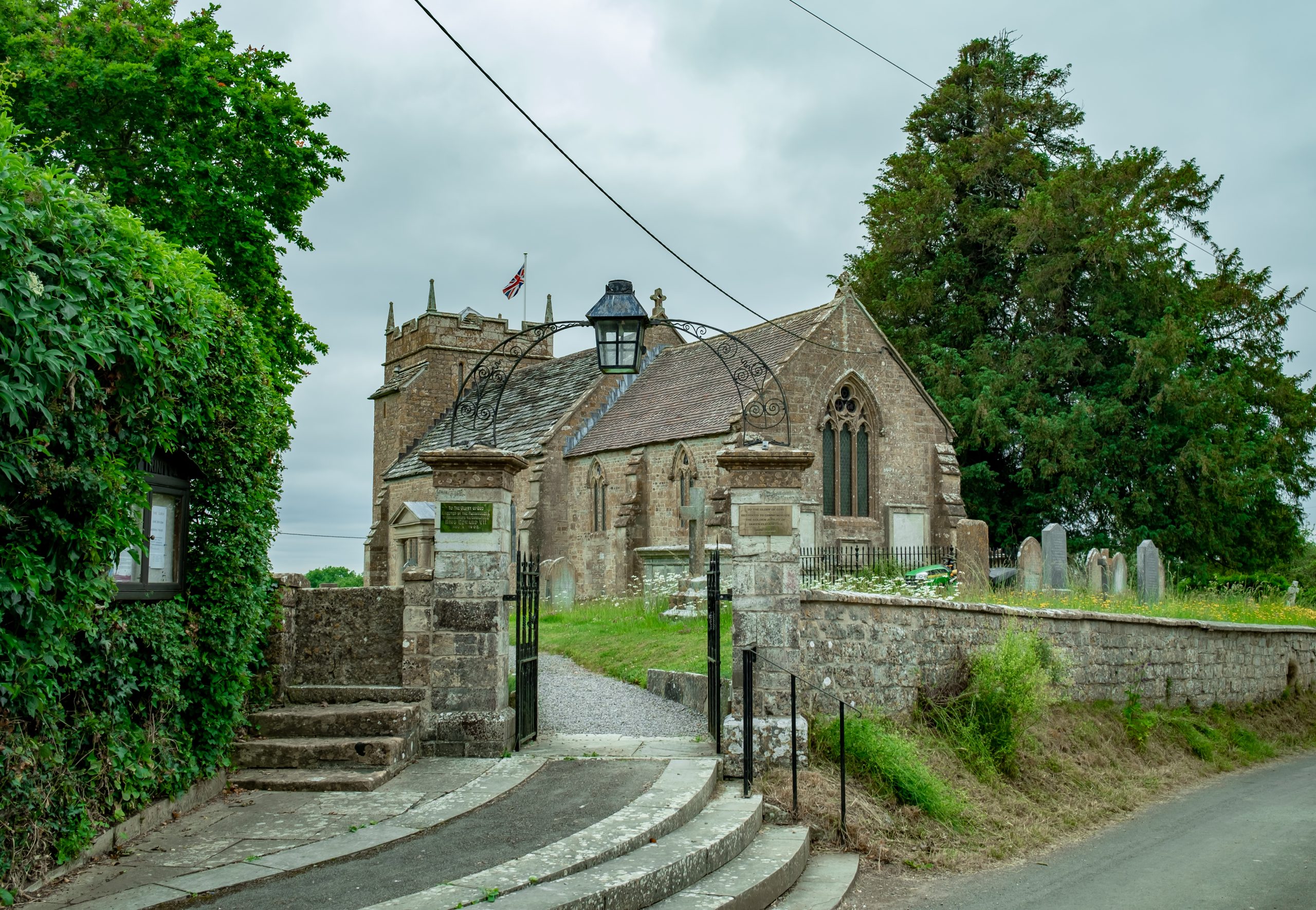Entrance to St Mary Magdalene Church and churchyard in Sparkford, Somerset