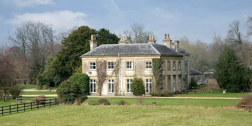 Sparkford Hall surrounded by gardens and countryside in Sparkford, Somerset