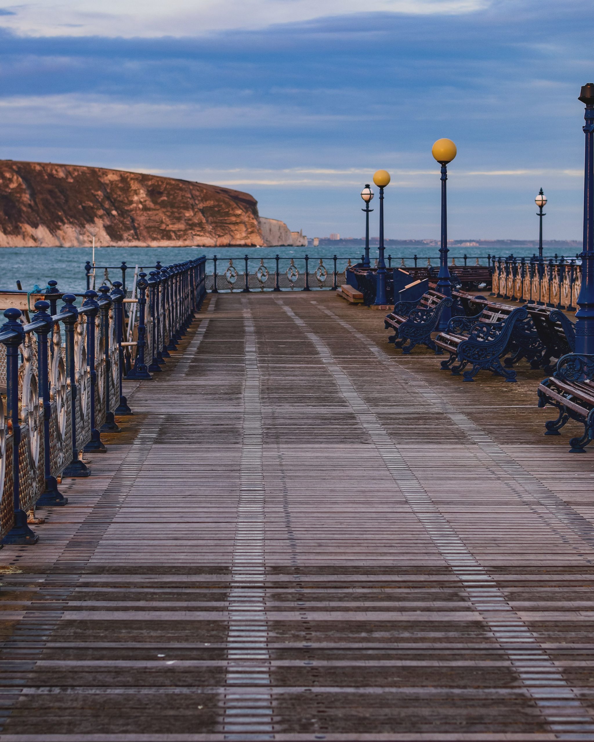 Swanage Pier overlooking the sea and Purbeck coastline in Dorset