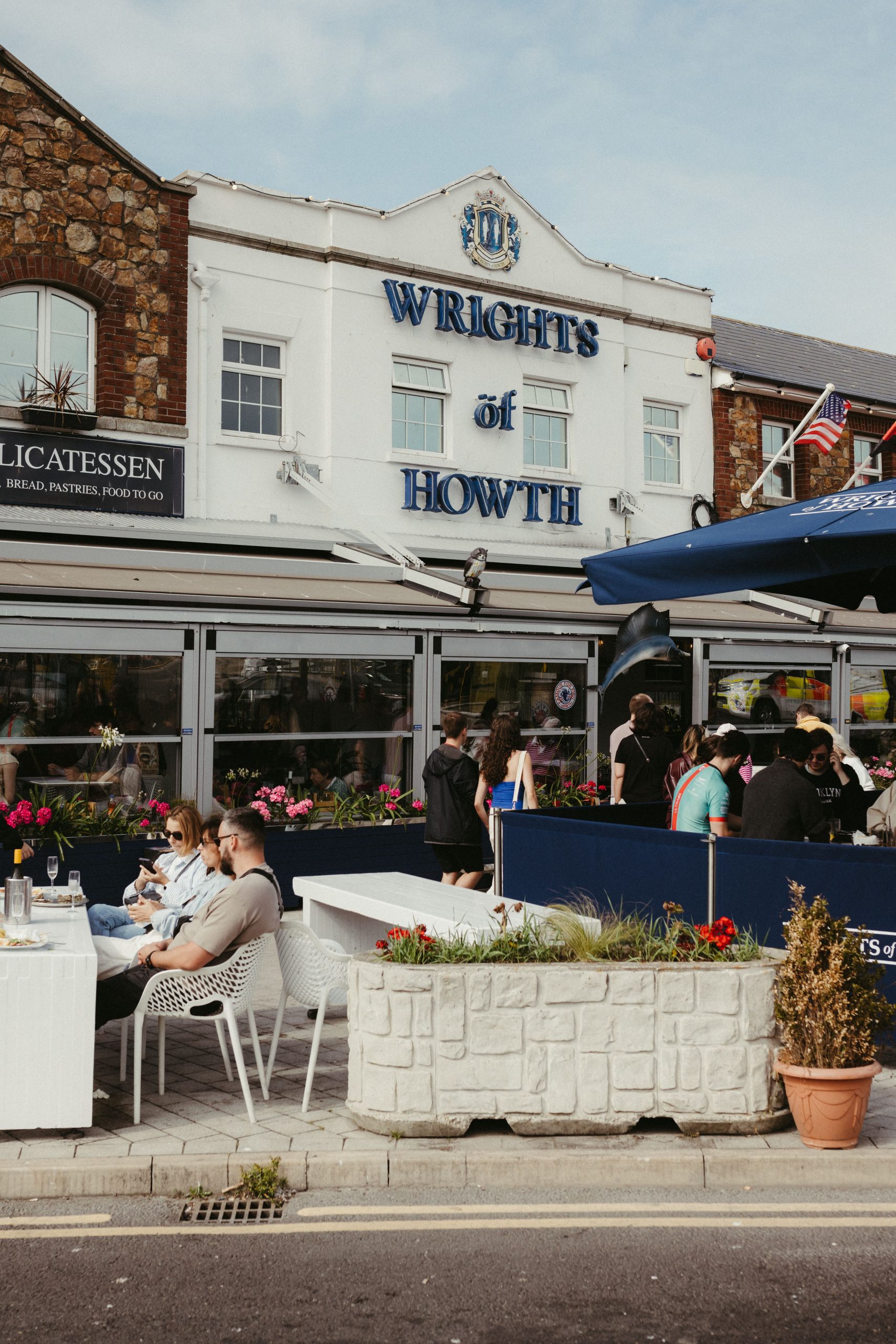 People dining near Weymouth Harbour in Dorset