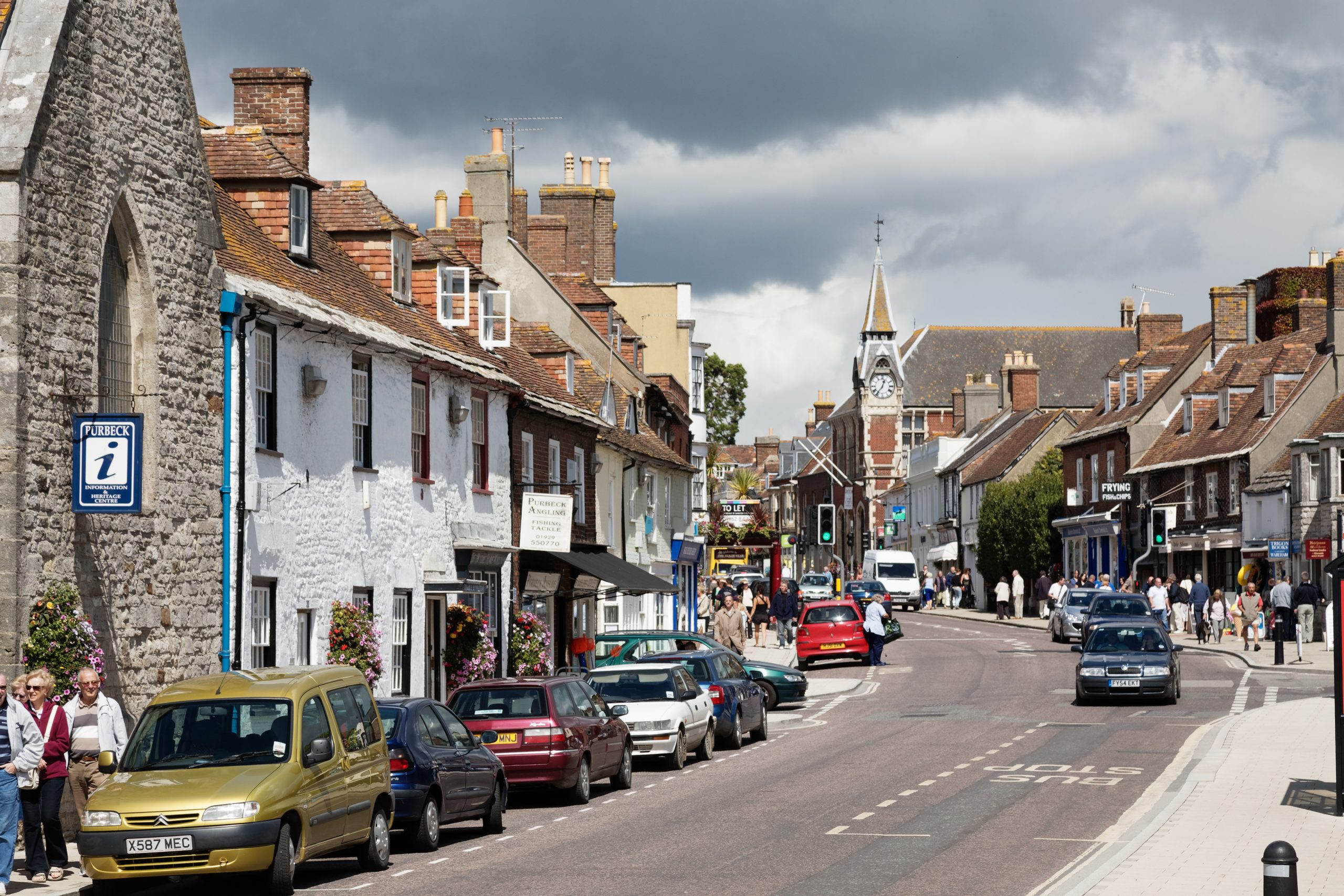 Wareham town centre with shops, pedestrians and historic buildings in Dorset