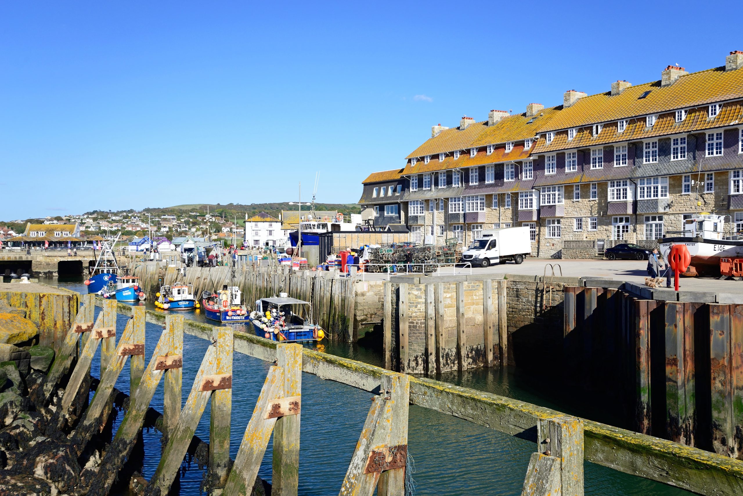 Fishing boats and quayside at West Bay Harbour near Bridport, Dorset