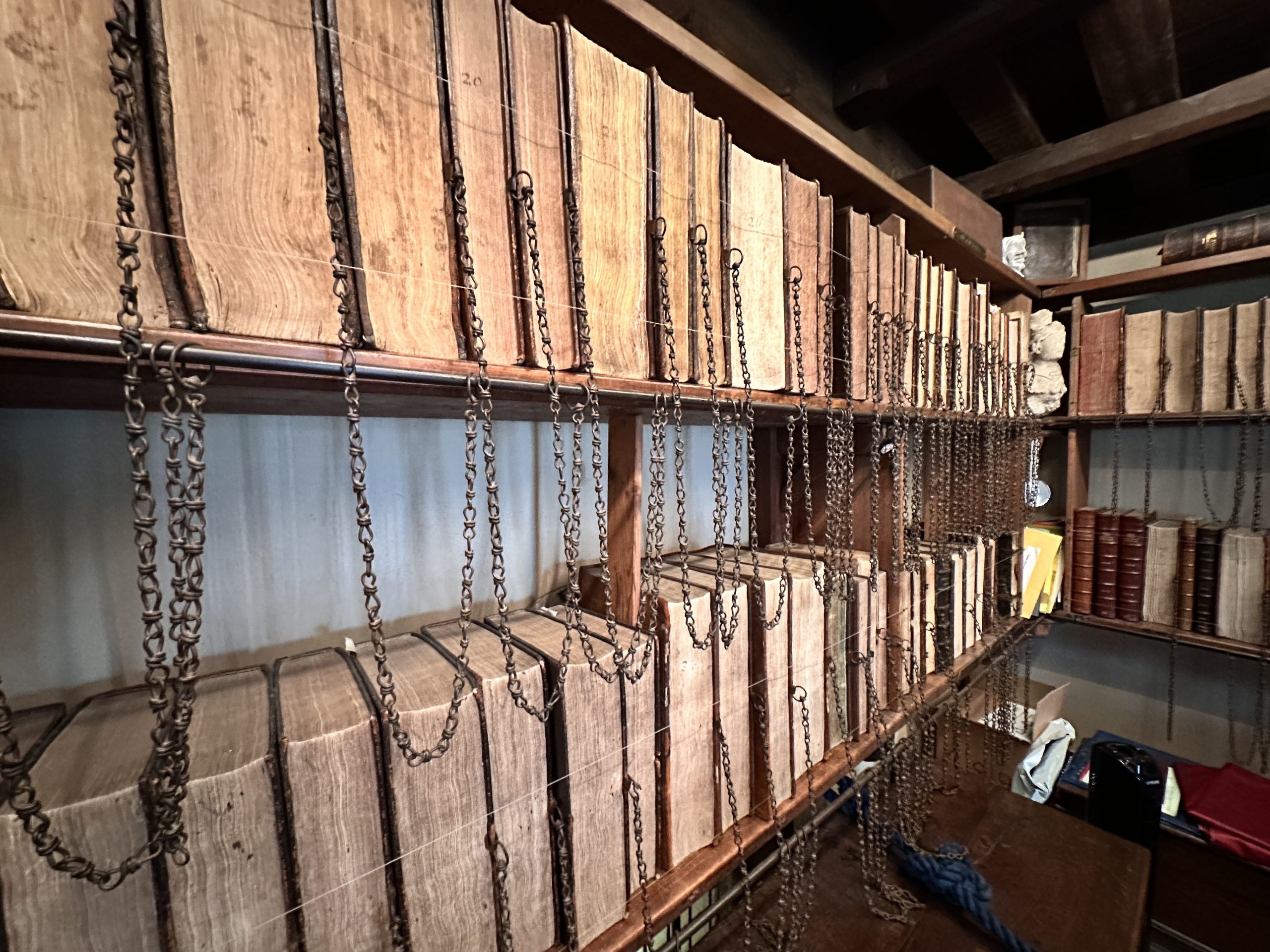 Historic chained books in the Chained Library at Wimborne Minster, Dorset
