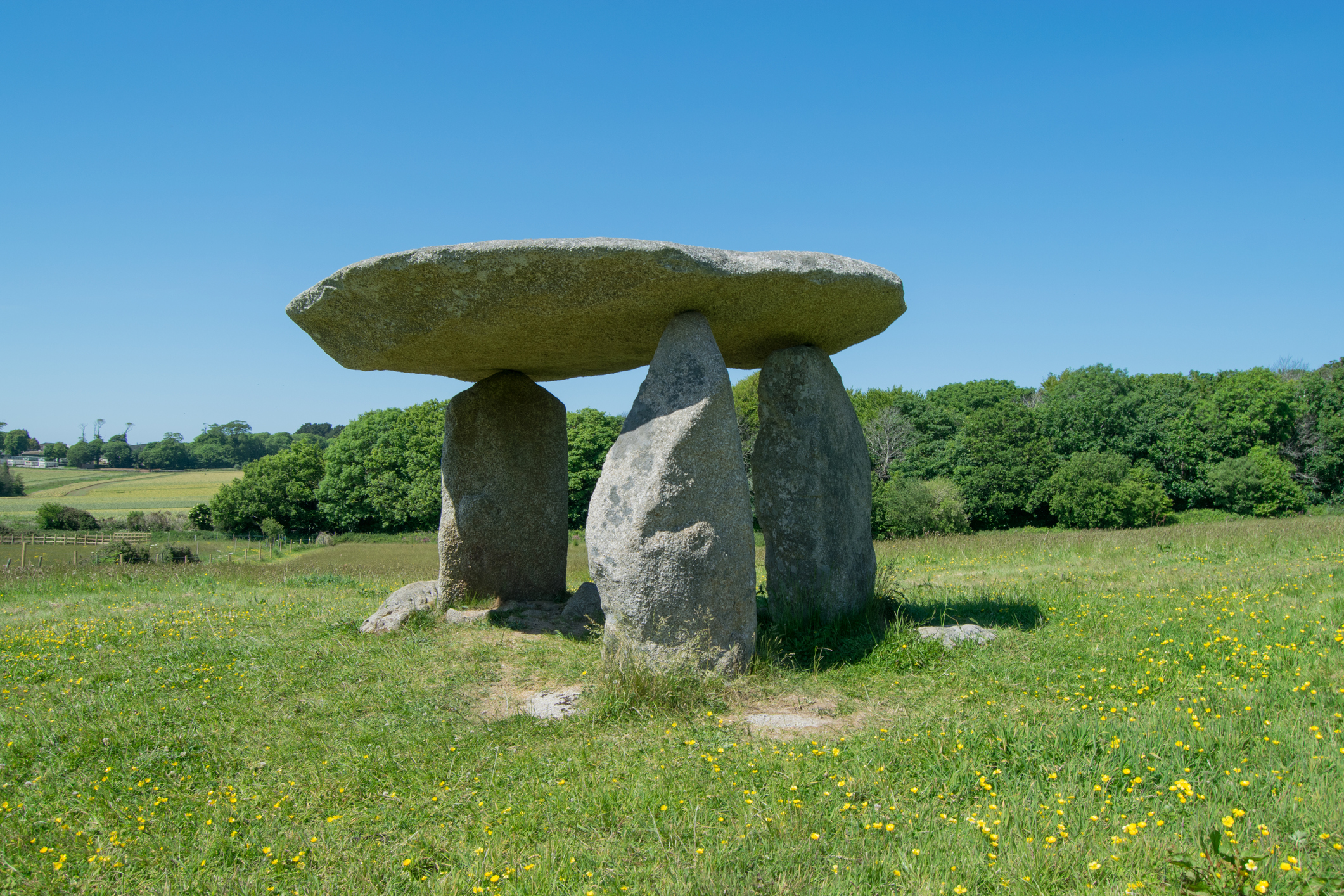 Prehistoric stone quoit standing in a grassy field in Cornwall
