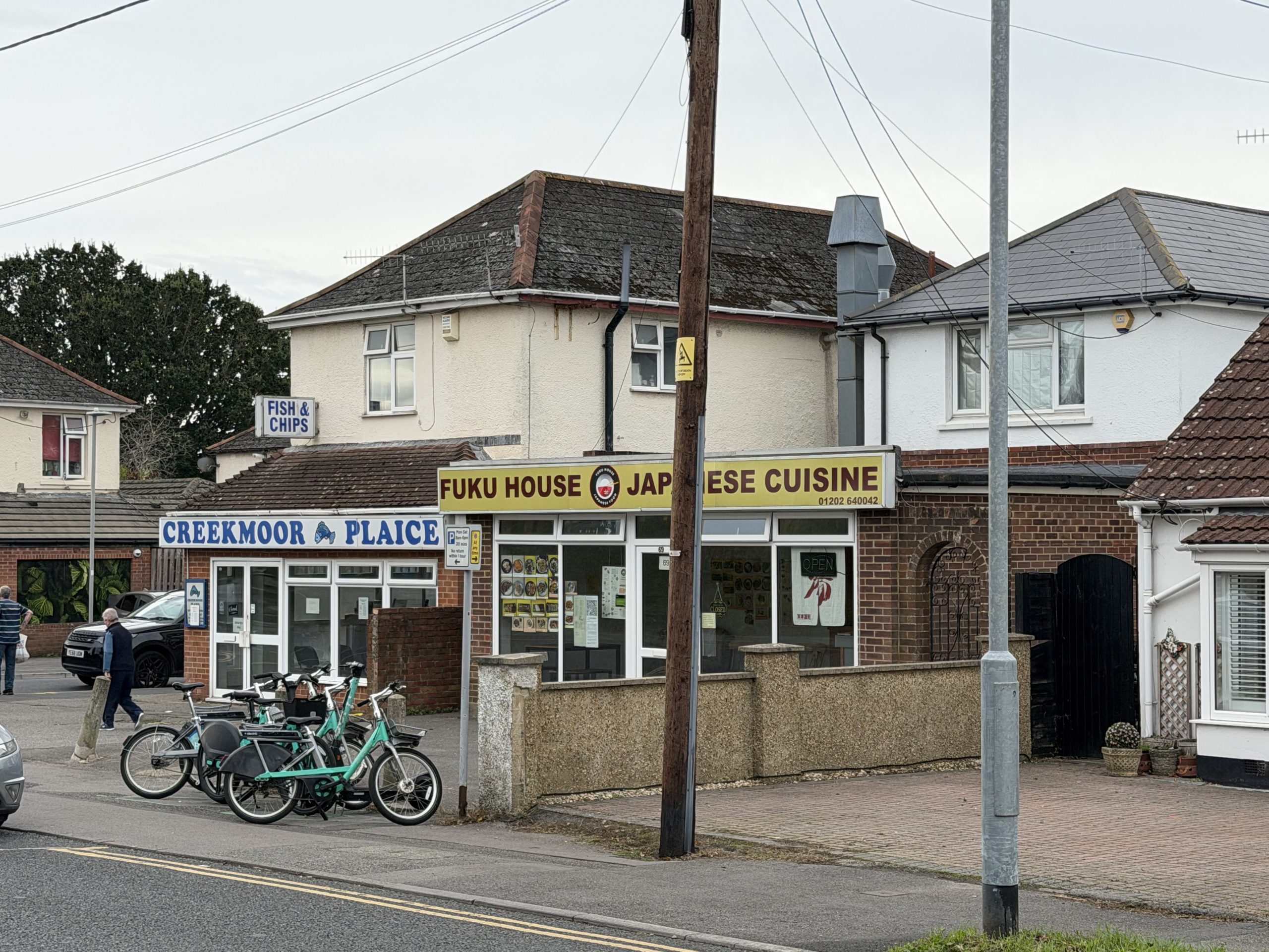 Local shops and food businesses in Creekmoor, Poole, Dorset, including Creekmoor Plaice and Fuku House.