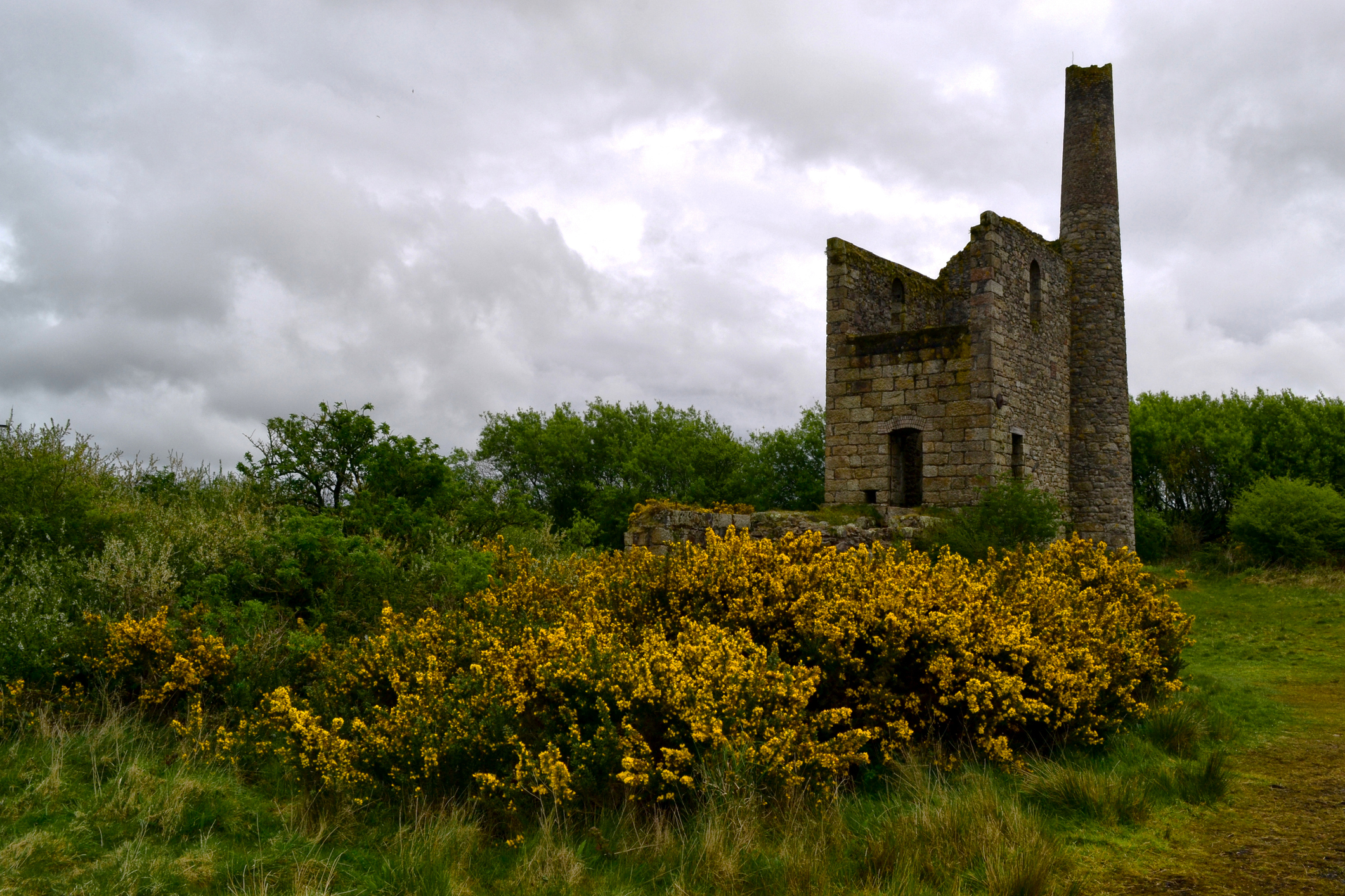 Historic Cornish mine engine house and chimney at Fortescue Mine near Camborne