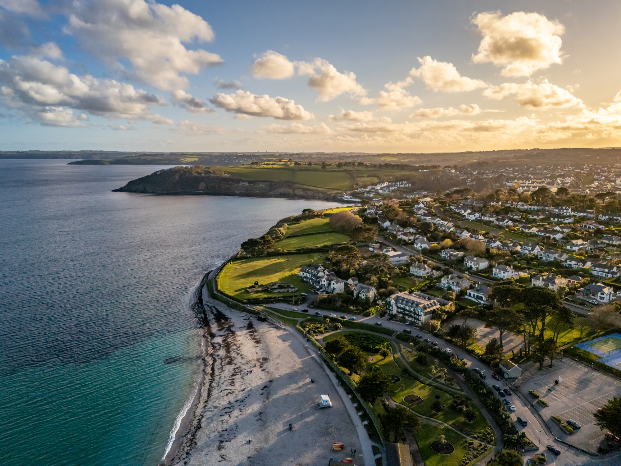 Aerial view of Gyllyngvase Beach, coastline and residential neighbourhoods in Falmouth