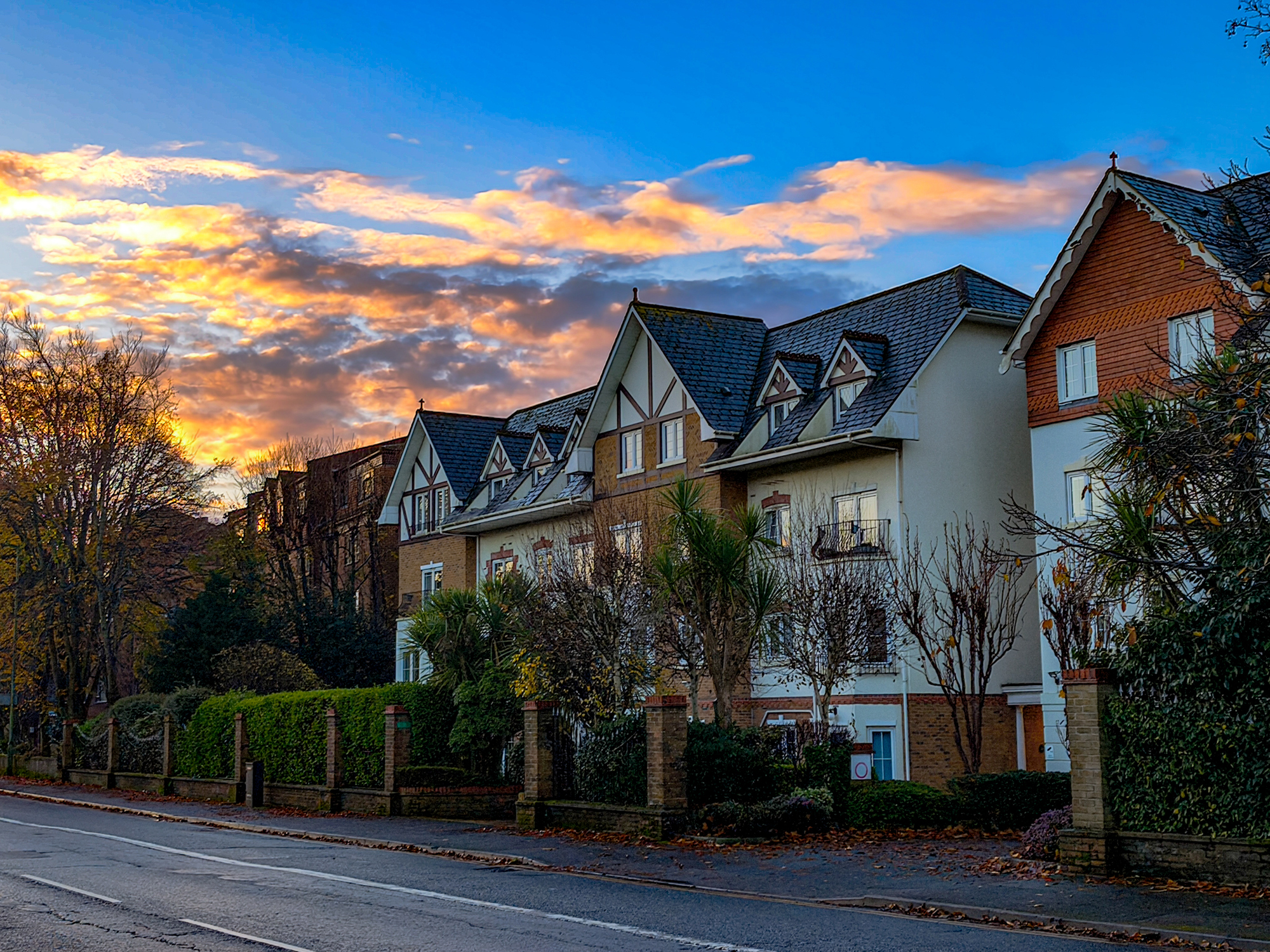Residential homes on a tree-lined street in Branksome, Dorset