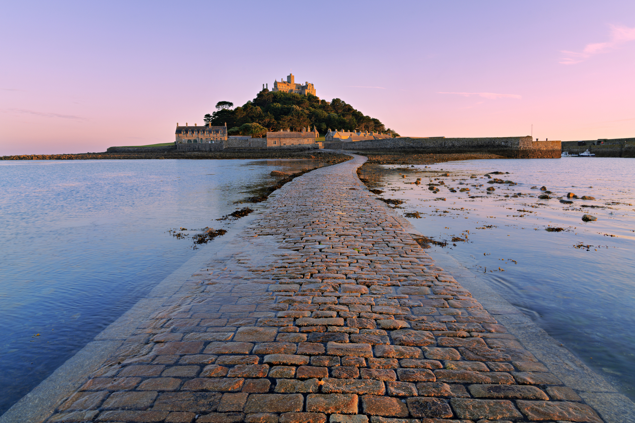 St Michael’s Mount near Penzance, Cornwall, with its historic castle and cobbled causeway at sunset.
