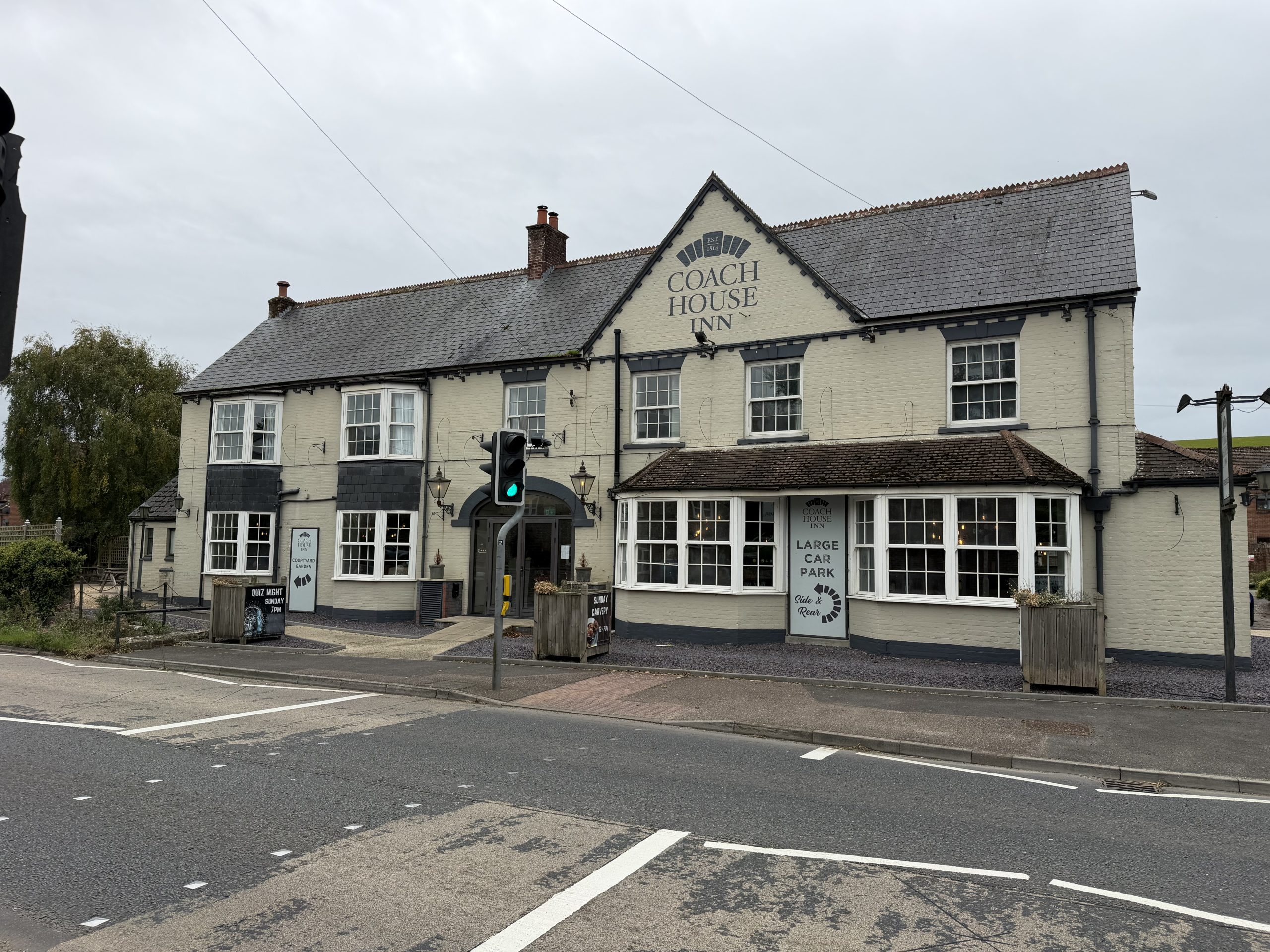 Coach House Inn in Winterbourne Abbas, Dorset, showing the traditional white-painted village inn.